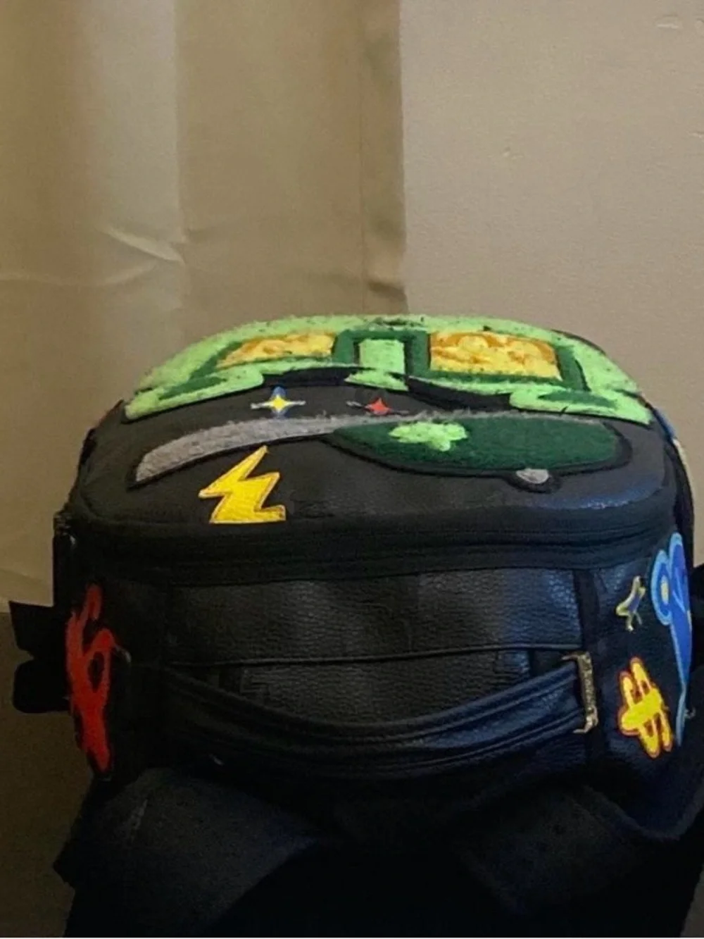 Black Backpack with Neon Green Bear Patch and Graphic Accents